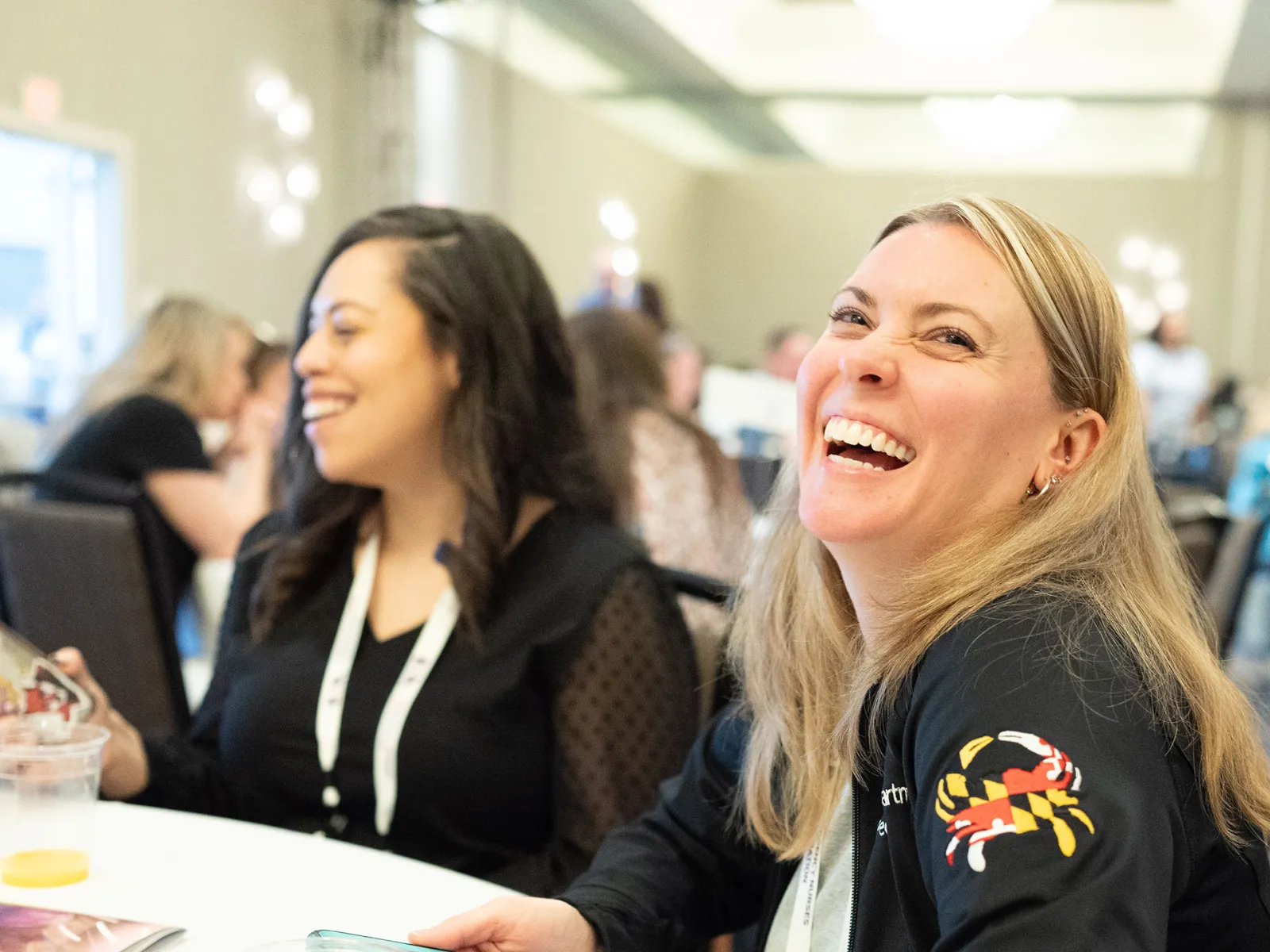 two ENA members laughing