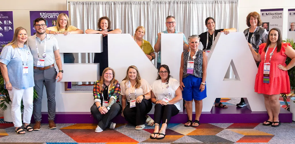 Group of members by the ENA sign